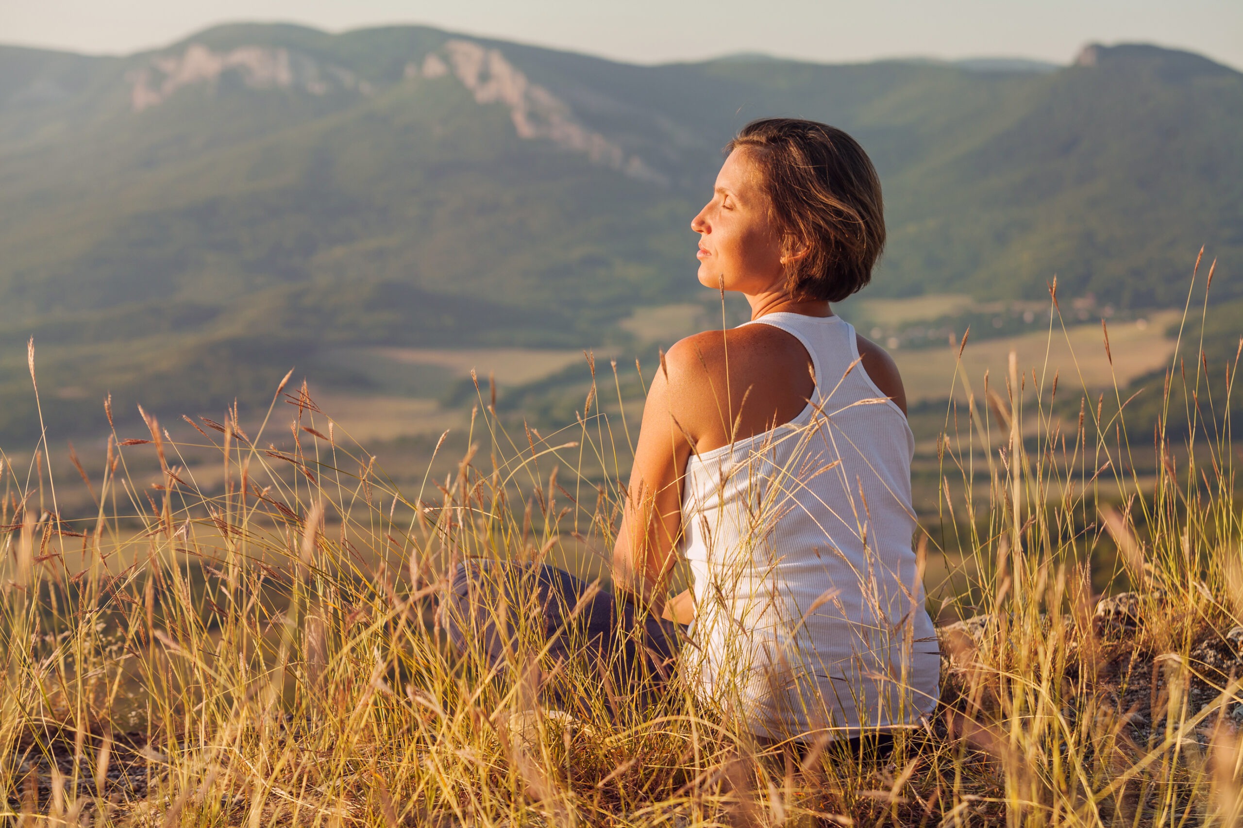 Friendly Multiracial Corporate Female Team Collaborate at Office sitting in Meditation Pose Woman Enjoyed with Gently Shining Sunrise