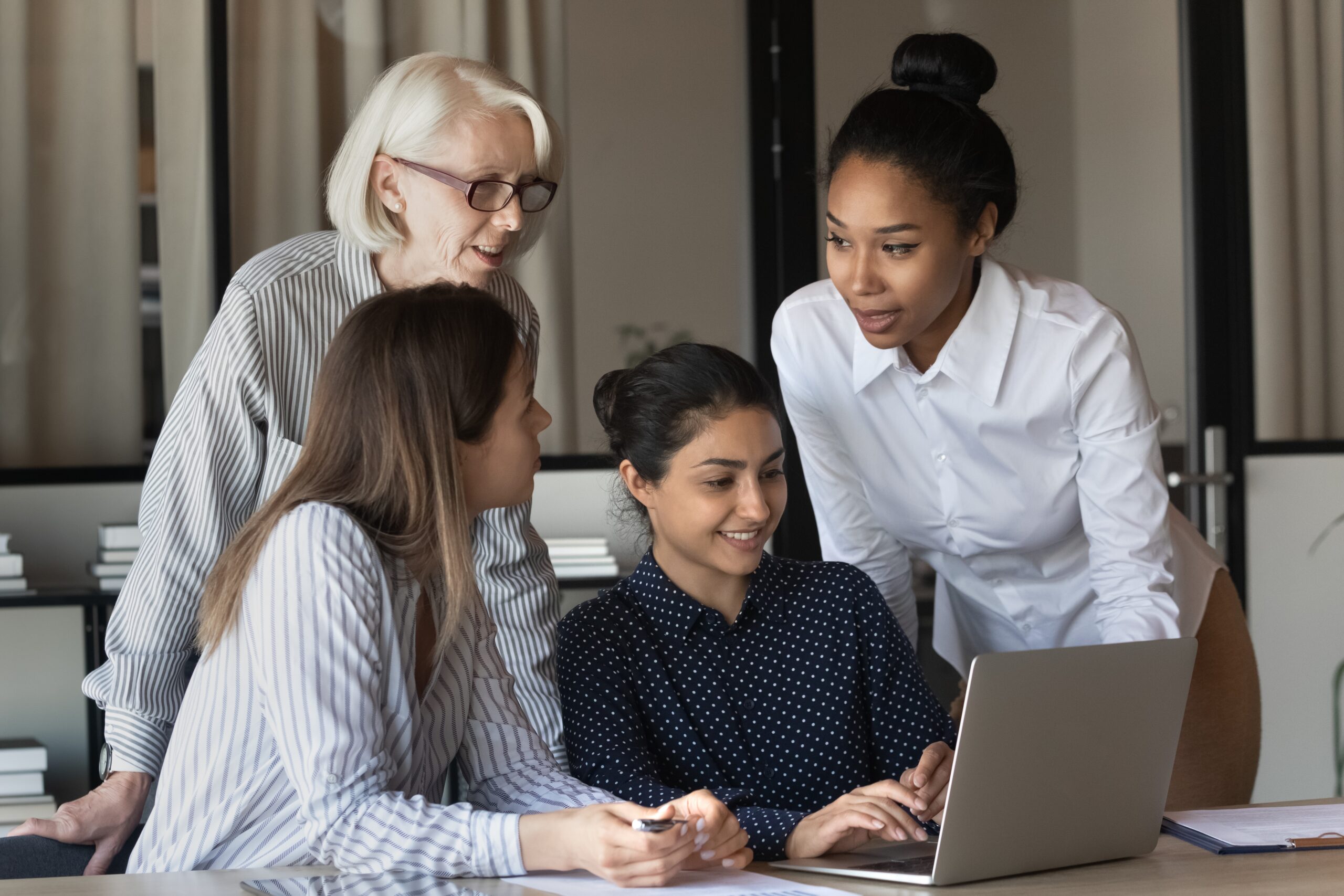 Friendly Multiracial Corporate Female Team Collaborate at Office