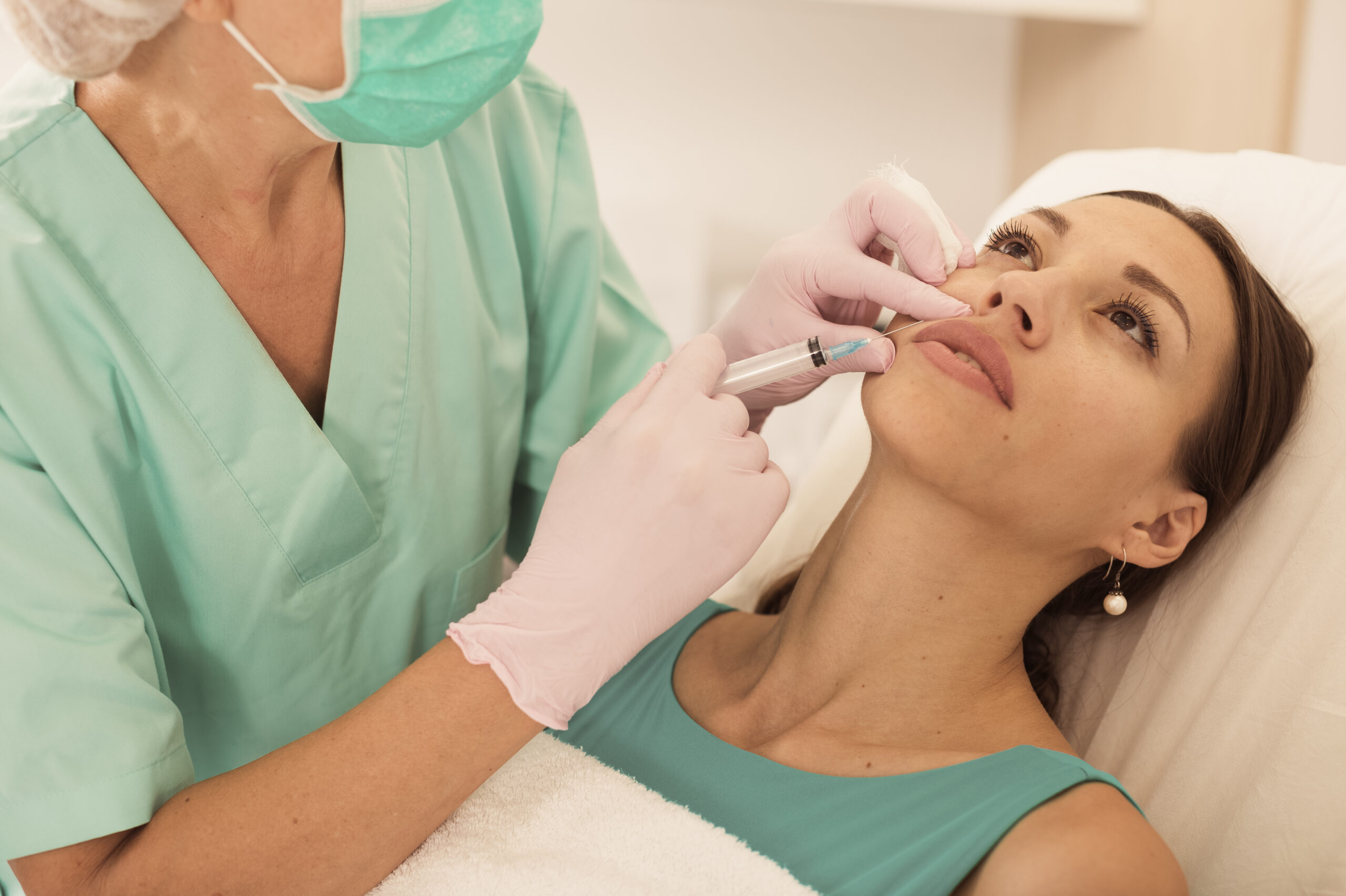 Young Woman Getting Injection for Facial Correction Procedure in Esthetic Clinic